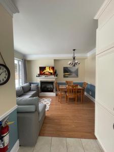 a living room with a couch and a table at Dida in Saint-Sauveur-des-Monts