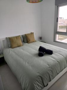 Ένα ή περισσότερα κρεβάτια σε δωμάτιο στο Casa Kelly