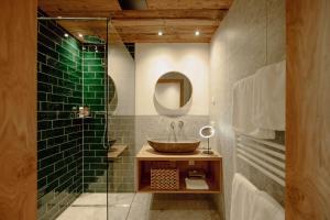 a bathroom with a sink and a glass shower at Uncle Jacks in Flachau