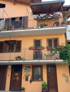 an apartment building with flower boxes on the balconies at Il Ciapiné in Giaveno