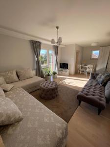 a living room with a couch and a table at Apartman Vera in Kremna
