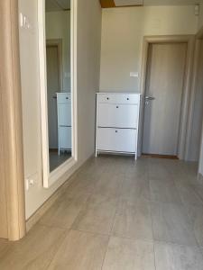 an empty room with a dresser and a mirror at Apartman Vera in Kremna