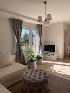 TV a/nebo společenská místnost v ubytování Apartman Vera + 9 fotografií