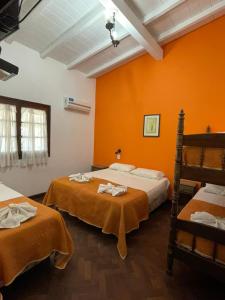 Un pat sau paturi într-o cameră la Complejo Turistico - Hotel Pinar serrano - Bialet Masse - Cordoba