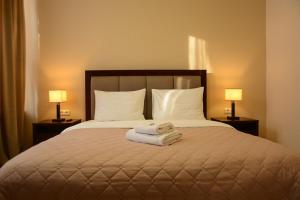 מיטה או מיטות בחדר ב-Hotel Voskresensky