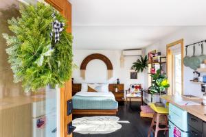 a bedroom with a bed with a green wreath at The Herwood Inn in Woodstock