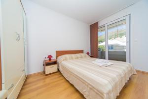 Postel nebo postele na pokoji v ubytování Apartment Dubrovnik Downtown