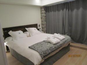 Katil atau katil-katil dalam bilik di Mauberme Mountain Boutique Hotel