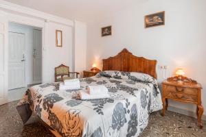 En eller flere senge i et værelse på Casa Anita