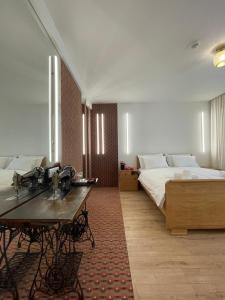 Ένα ή περισσότερα κρεβάτια σε δωμάτιο στο ConnectIN Apartments