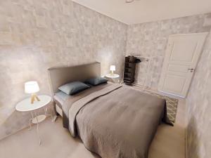 Postel nebo postele na pokoji v ubytování Nika Apartments