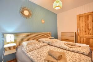 Posteľ alebo postele v izbe v ubytovaní Apartamenty Maja i Zuzia