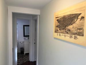 a room with a painting on the wall and a picture on the wall at The Garden House in Key West