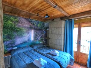 Ένα ή περισσότερα κρεβάτια σε δωμάτιο στο Casa Quinito