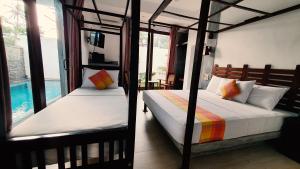 A bed or beds in a room at Anama by Queens Mount