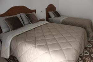 Postel nebo postele na pokoji v ubytování B&B Dei Cardinale