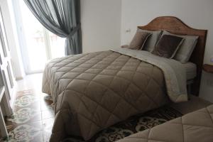 Postel nebo postele na pokoji v ubytování B&B Dei Cardinale