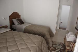 Postel nebo postele na pokoji v ubytování B&B Dei Cardinale