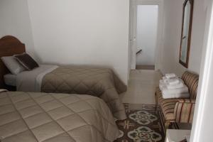 Postel nebo postele na pokoji v ubytování B&B Dei Cardinale