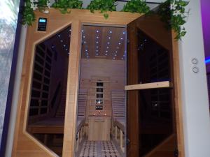 a door leading to a wine cellar with lights at Loveroom 54 in Jarville-la-Malgrange