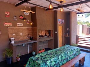 a room with a bed and a sink and a counter at Complejo Solar Del Iguazu 2 in Puerto Iguazú