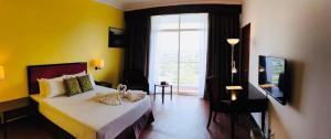 Ένα ή περισσότερα κρεβάτια σε δωμάτιο στο EHSAN SEAVIEW HOTEL PORT DICKSON