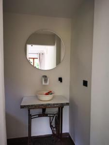 a bathroom with a sink and a mirror at Hotel Boutique Albania in Otanche