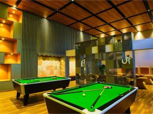 a billiard room with a pool table in a room at The Landmark Banjara Hills - Hyderabad in Hyderabad