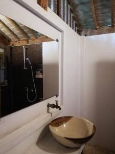 a bathroom with a wooden sink and a shower at Banpainamhomestay in Ban Huai Thalaeng Phan