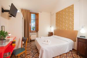 Ένα ή περισσότερα κρεβάτια σε δωμάτιο στο Hotel Diana & Depandance