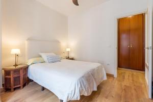 A bed or beds in a room at El Carmen Flat