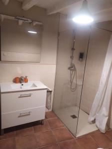 a bathroom with a shower and a sink at Ca La Marutxi in Cantallops