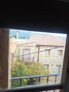 a view of a building from a window at Ca La Marutxi in Cantallops