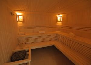 a sauna with a bench and two windows in it at Dave Hotel Yerevan in Yerevan