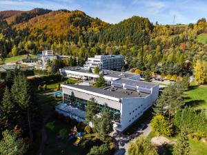 an aerial view of a building in the mountains at Hotel Perła Południa in Rytro