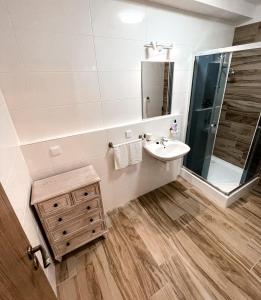 a bathroom with a sink and a mirror at Apartmán Rajecké Teplice in Žilina