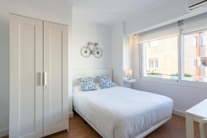 Ein Bett oder Betten in einem Zimmer der Unterkunft LU&CIA Malagueta 9