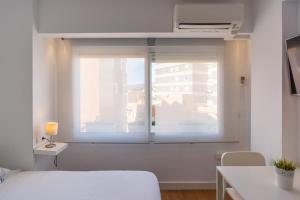 Ein Bett oder Betten in einem Zimmer der Unterkunft LU&CIA Malagueta 9