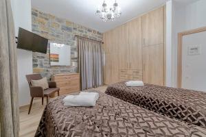Un pat sau paturi într-o cameră la Faraggi Villas