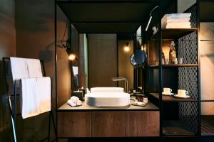 a bathroom with a sink and a mirror at Hotel Maestoso - Lipica in Sežana