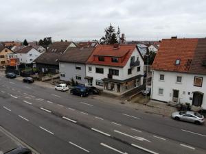 a view of a town with cars parked on a street at apartment Lampertheim in Lampertheim +8 photos