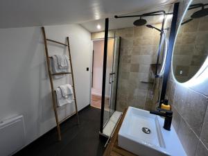 a bathroom with a sink and a shower at Hôtel les Chaumettes in Savines +41 photos