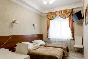 Кровать или кровати в номере Hotel Calypso