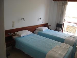 Postel nebo postele na pokoji v ubytování Dimitris Rooms