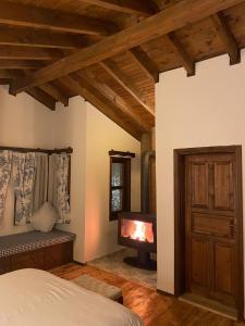 a bedroom with a fireplace and a bed with a bed sqor at Piccolo Mondo Hotel in Ağva
