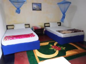 Ένα ή περισσότερα κρεβάτια σε δωμάτιο στο Lily adam's peak +30 φωτογραφίες