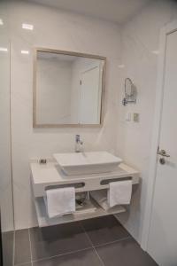 Koupelna v ubytování Calamar Hotel