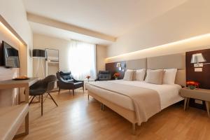 Ένα ή περισσότερα κρεβάτια σε δωμάτιο στο La Reggia Sporting Center Hotel