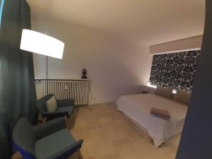 Posteľ alebo postele v izbe v ubytovaní Baretti House- Parcheggio Riservato per un soggiorno Perfetto