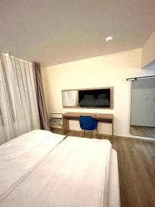 Katil atau katil-katil dalam bilik di O&O Hotel Oberursel Zentrum